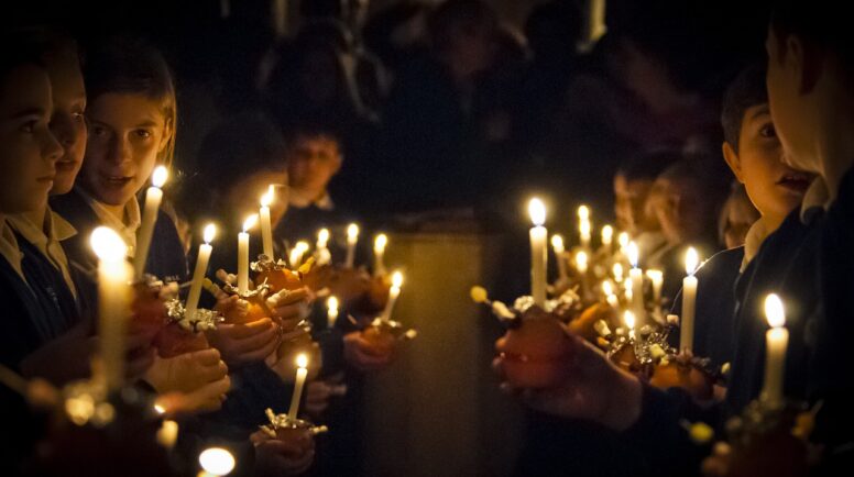 A group of children holding candles