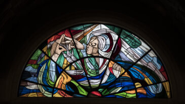 artistic stained glass window in the sanctuary of Fatima, a famous place of worship in Portugal