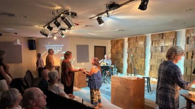 Pastor Cody Deese leads a service at Vinings Lake