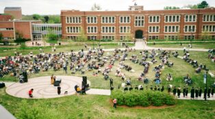 A college quad with many students on it