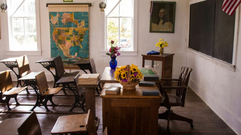 A classroom with posters on the wall.