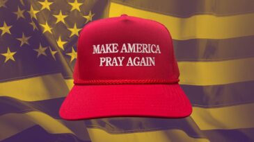 An "Make America pray again" hat against an American flag background