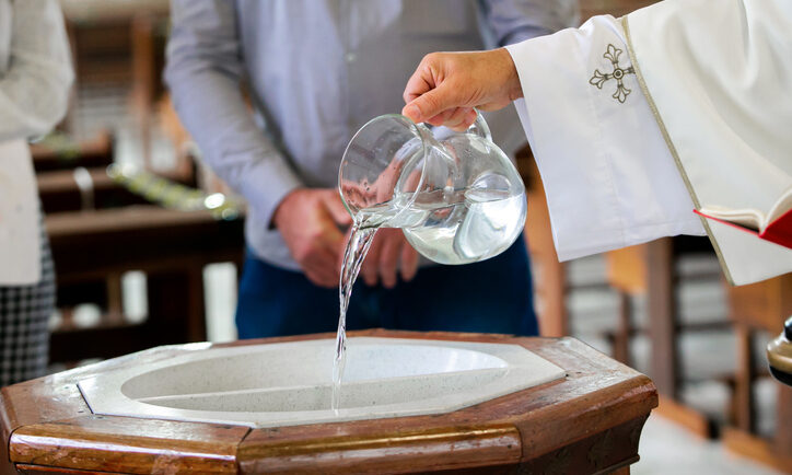 Daily Bread. Holy water used to initiate a child, through baptism, in the Christian religion