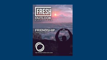 A person standing on a mountain making a heart with their hands. This image symbolizes the Fresh Outlook Friendship curriculum, a friendship bible study.