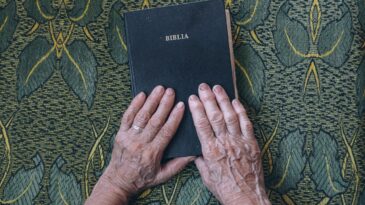 hands on bible cover