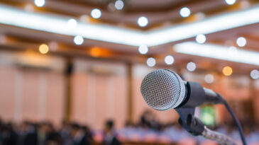 Microphone abstract prepare for speaker speech of conference or seminar hall at exhibition room background.
