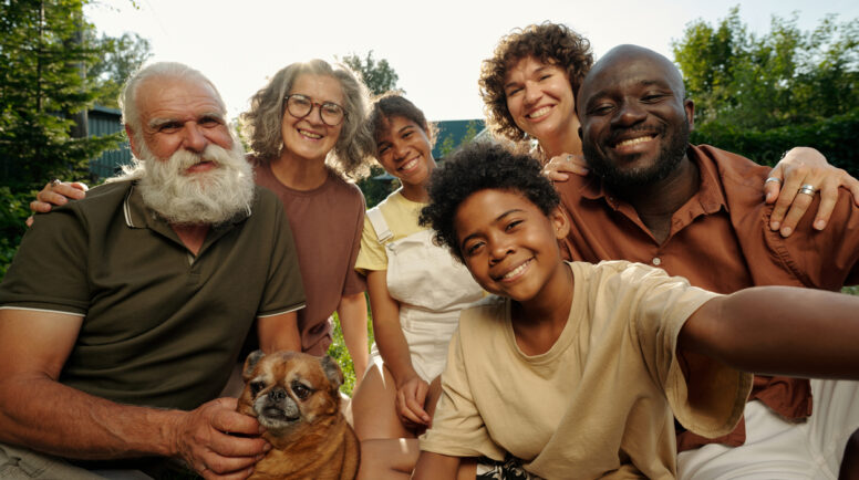 Church diversity and inclusion. Happy intercultural family of three generations taking a selfie.