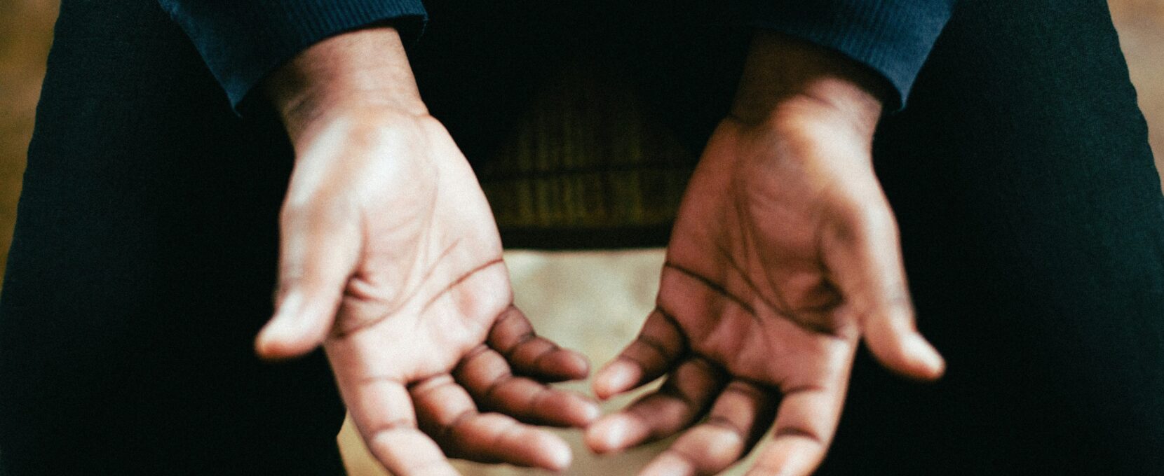 Hands open in prayer