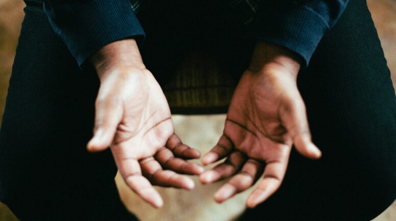 Hands open in prayer