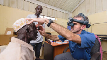 Samaritan's Purse doctor Ben Roberts assesses a cataract patient in South Sudan in 2020.