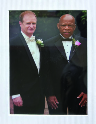 John Lewis and Wade Burns stand next to each other in tuxedos.