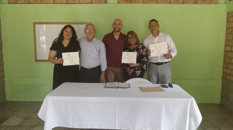 Joseph Russ (center) with participants upon receiving their certificates in migrant ministries (photo contributed by Joseph Russ).