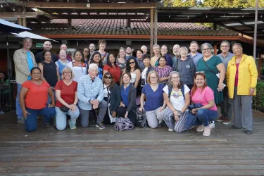 Students studying for the certificate in Migrant Ministries pose for a picture outside.