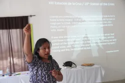 A woman speaks into a microphone