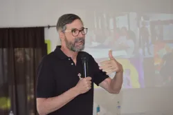 A man speaks into a microphone.