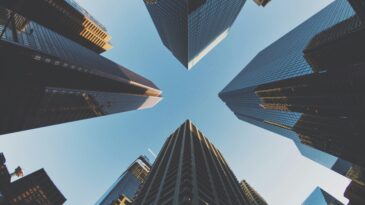 A photo of skyscrapers, taken from street level looking upwards