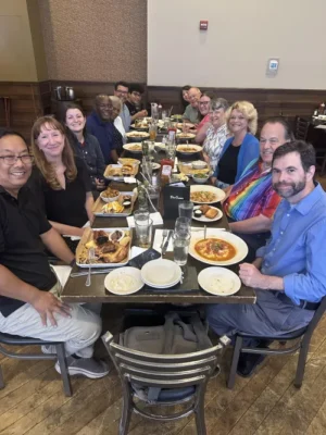 Members of the Ordination Task Force and staff enjoy a meal together (contributed photo).