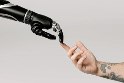 robot hand and humb hand replicate God and David in Michaelangelo's "The Creation of Adam"