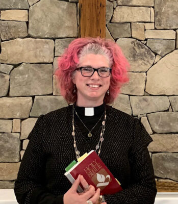 A woman poses with a bible