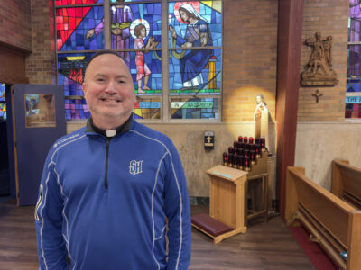 A man stands in a sanctuary