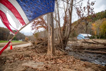A frayed but standing flag waves days after flooding across from the U.S. Forest Service's 