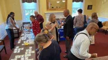 A group of people gather in a room