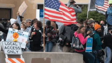A group gathers outside of the ICE detention center in Broadview, Illinois.