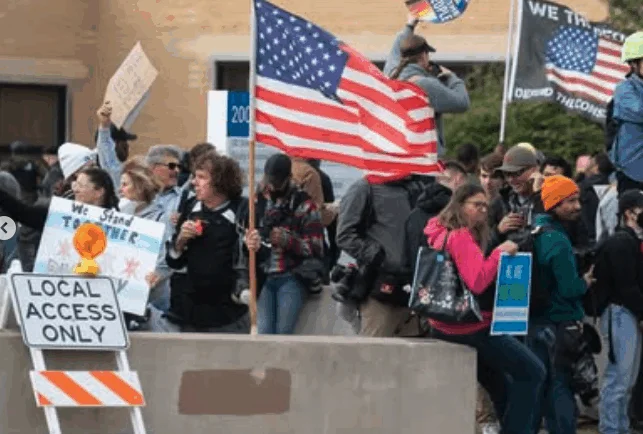 A group gathers outside of the ICE detention center in Broadview, Illinois.
