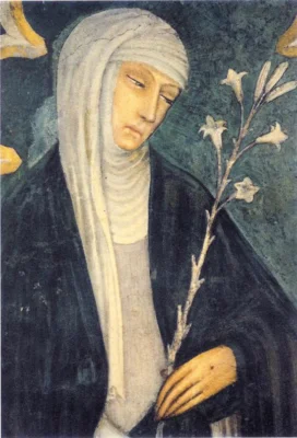St. Catherine of Sienna stands, looking at a lily, dressed in blue.