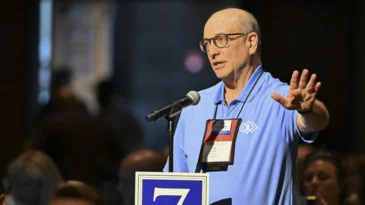 Frank Clark Spencer stands to address 226th General Assembly