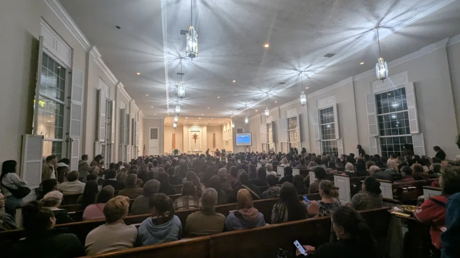 a photo from the back of a church with the pews full of people at a recent Siembra NC training event.
