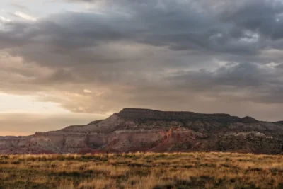 Sunset approaches as grey clouds gather over Ghost Ranch. 