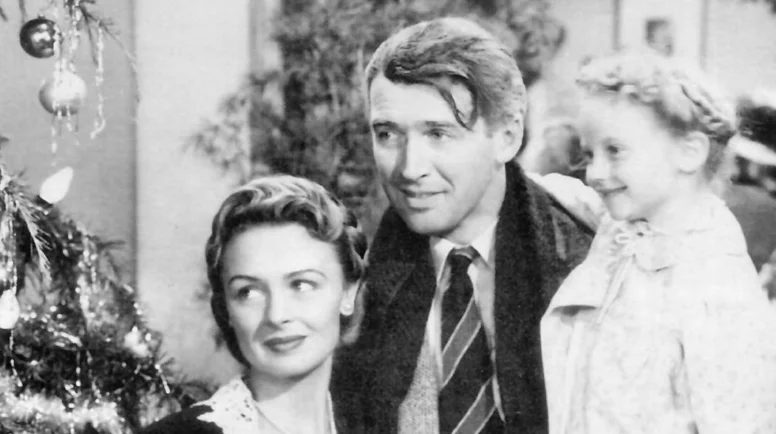 Jimmy Stewart, Donna Reed, and Karolyn Grimes in "It's a Wonderful Life" (1946). (National Telefilm Associates via WikiMedia Commons)