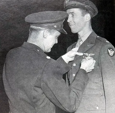 Colonel James Stewart being awarded his Distinguished Flying Cross. Image source: The Jimmy Stewart Museum.
