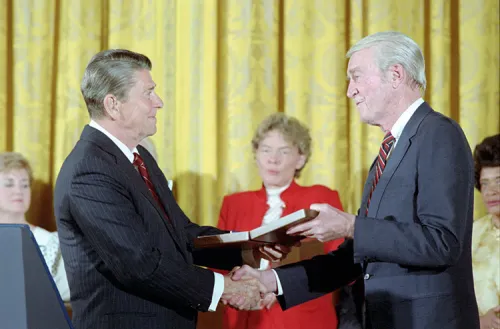 James Stewart shakes the hand of President Ronald Reagan as he is awarded the Presidential Medal of Freedom in 1985.