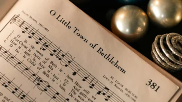 A hymnal opened to "O Little Town of Bethlehem."