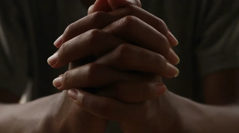 hands folded in prayer
