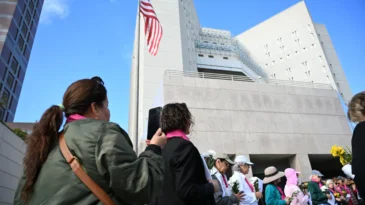 Godmothers of the Disappeared holds weekly vigils to protest the disappearance and detention of immigrants by U.S. Immigration and Customs Enforcement (ICE). (Photo by Kristen Gaydos)