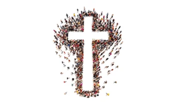 People in a group standing in the shape of a cross.