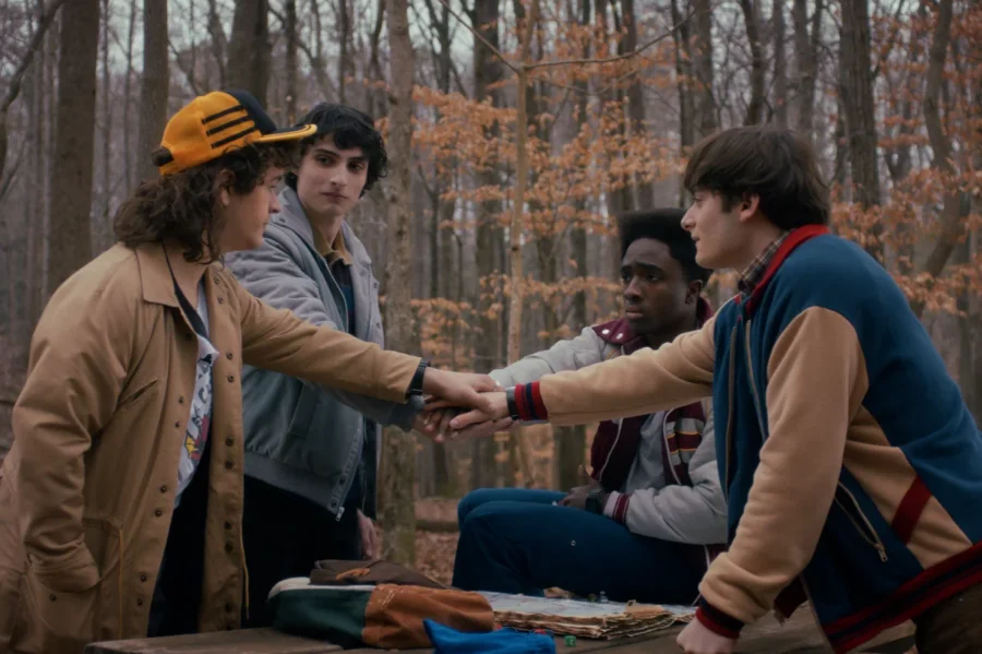 Gaten Matarazzo as Dustin Henderson, Finn Wolfhard as Mike Wheeler, Caleb McLaughlin as Lucas Sinclair, and Noah Schnapp as Will Byers.