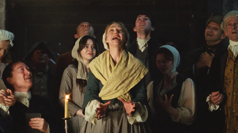 Amanda Seyfried, center, and ensemble in “The Testament of Ann Lee." (Photo © 2025 Searchlight Pictures)