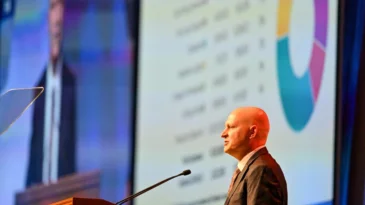 Man speaking at a podium