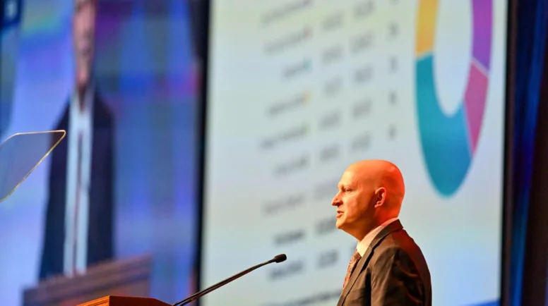 Man speaking at a podium