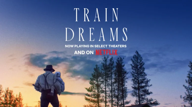 A man stands against a sun set holding a baby. Picture includes the text, "Train Dreams: now playing in select theaters and on netflix"