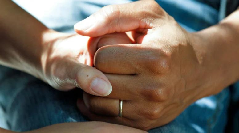 A couple holding hands