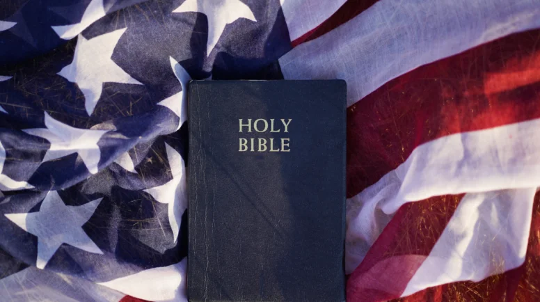Bible sitting on top of the American flag