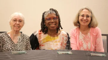 Blanca Estrella Otaño-Rivera, Selma Jackson and Adele Langworthy (from left) pictured smiling together at the Women of Faith Breakfast