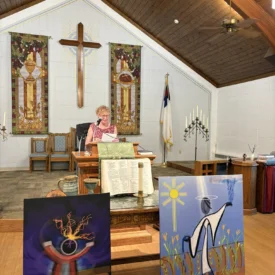 Litugist Charlene Eck reads at Faith Presbyterian