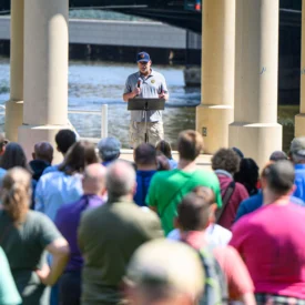 Former Major League Baseball pitcher Frank Cimorelli stands in front of a crowd.