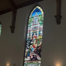 One of the stained glass window panes inside of Immanuel Presbyterian Church